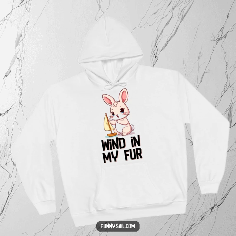 Funny hoodie with a determined rabbit adjusting a tiny sail with its paw, embodying focus and effort.