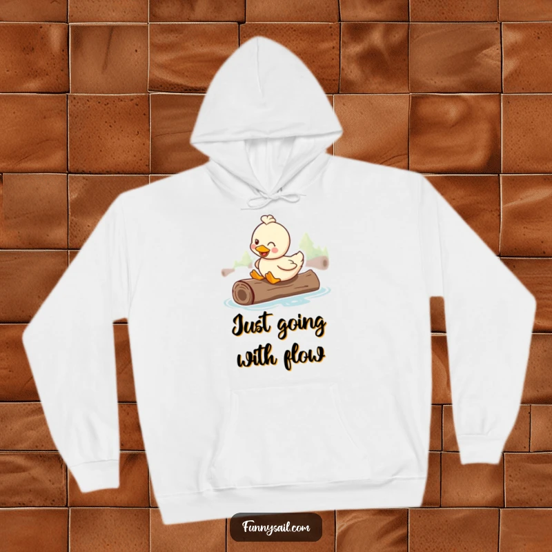 Funny hoodie with a happy duck smiling contentedly while riding on a floating log, embodying ultimate chill.