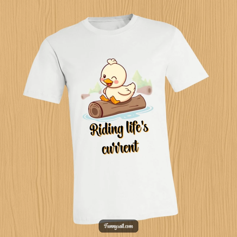 Funny t-shirt featuring a smiling duck happily riding on a floating log, embodying relaxation and joy.